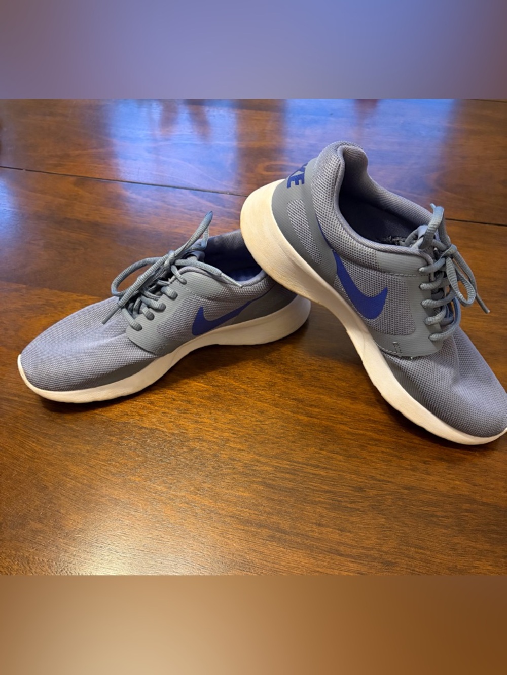 Nike Gray Athletic Sneakers with Blue Swoosh